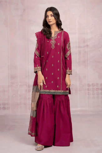 Woman wearing magenta embroidered Pakistani suit with wide-leg trousers and dupatta