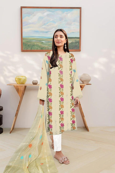 Woman in a beige floral embroidered kurta with dupatta, standing indoors, modern home decor